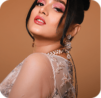 Glamour beauty model in beaded dress looking upward