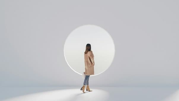 Places We Become Ourselves - Minimalist architectural portrait with circular light portal